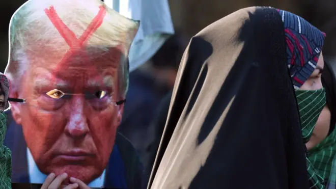 Members of Iran's female paramilitary force (Basij) hold up an image of Donald Trump with a red X across his forehead during a protest in Tehran on 10 January 2025, days before his January 2025 inauguration