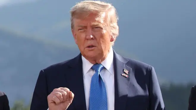 US President Donald Trump gestures as he attends a family photo session during the G7 summit in Kananaskis, Alberta, Canada. Picture date: Monday June 16, 2025.