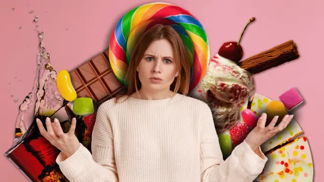 图片显示一名女子站在琳瑯满目的糖果点心面前。