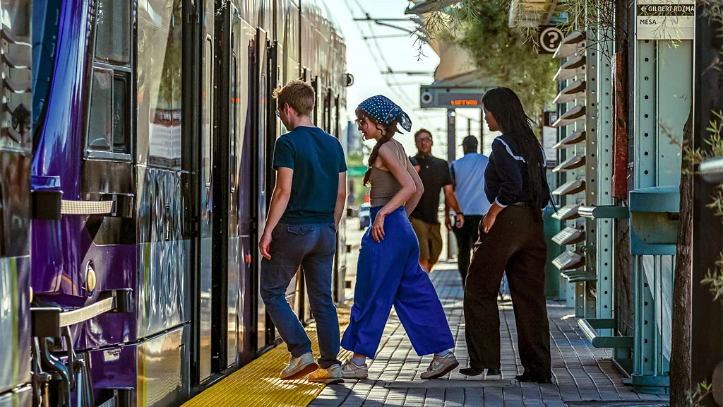 People riding bikes along a street in Culdesac, Arizona (Credit: Courtesy of Culdesac)