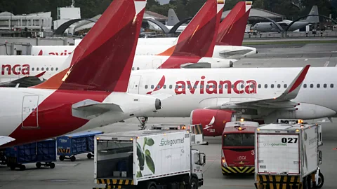 Airbus A320s lined up on the asphalt at an airport tarmac (Credit: Getty Images)