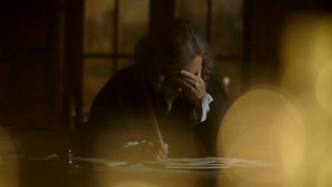 Actor playing Newton looking exhausted