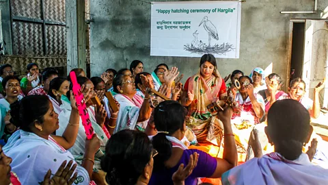 Hargila Army Barman (centre) with members of the Hargila Army at a ceremony celebrating the hatching of stork chicks (Credit: Hargila Army)