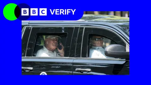 President Trump looking out of the window of his limousine as he takes a call, driver with sun glasses on it the front seat, surround by a blue border and a BBC Verify logo in the top right corner.