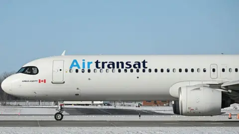 An Air Transat plane n the runway at Montreal-Pierre Elliott Trudeau International Airport 