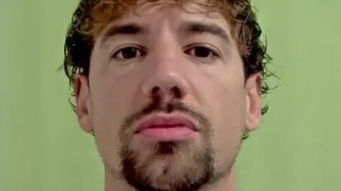 IOM CONSTABULARY Police mugshot of Kane Jones, who has brown hair and a goatee.