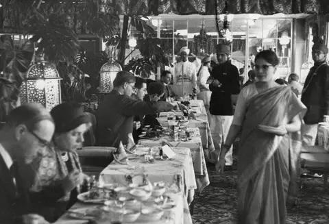 Veeraswamy Veeraswamy customers in the 1930s looking very formal with serving staff in Indian-style clothes