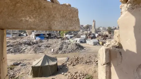 Tents and the Great Omari Mosque are seen from the ruins of the Pasha's Palace in Gaza City, northern Gaza