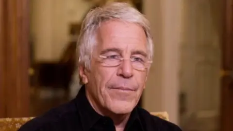 Jeffery Epstein in a black shirt and glasses