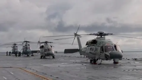 Reuters Helicopters on an amphibious assault ship take part in military drills in waters southeast of Taiwan, from a screenshot of a video released by the Chinese military's Eastern Theatre Command