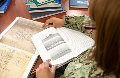Students reading books in the learning commons